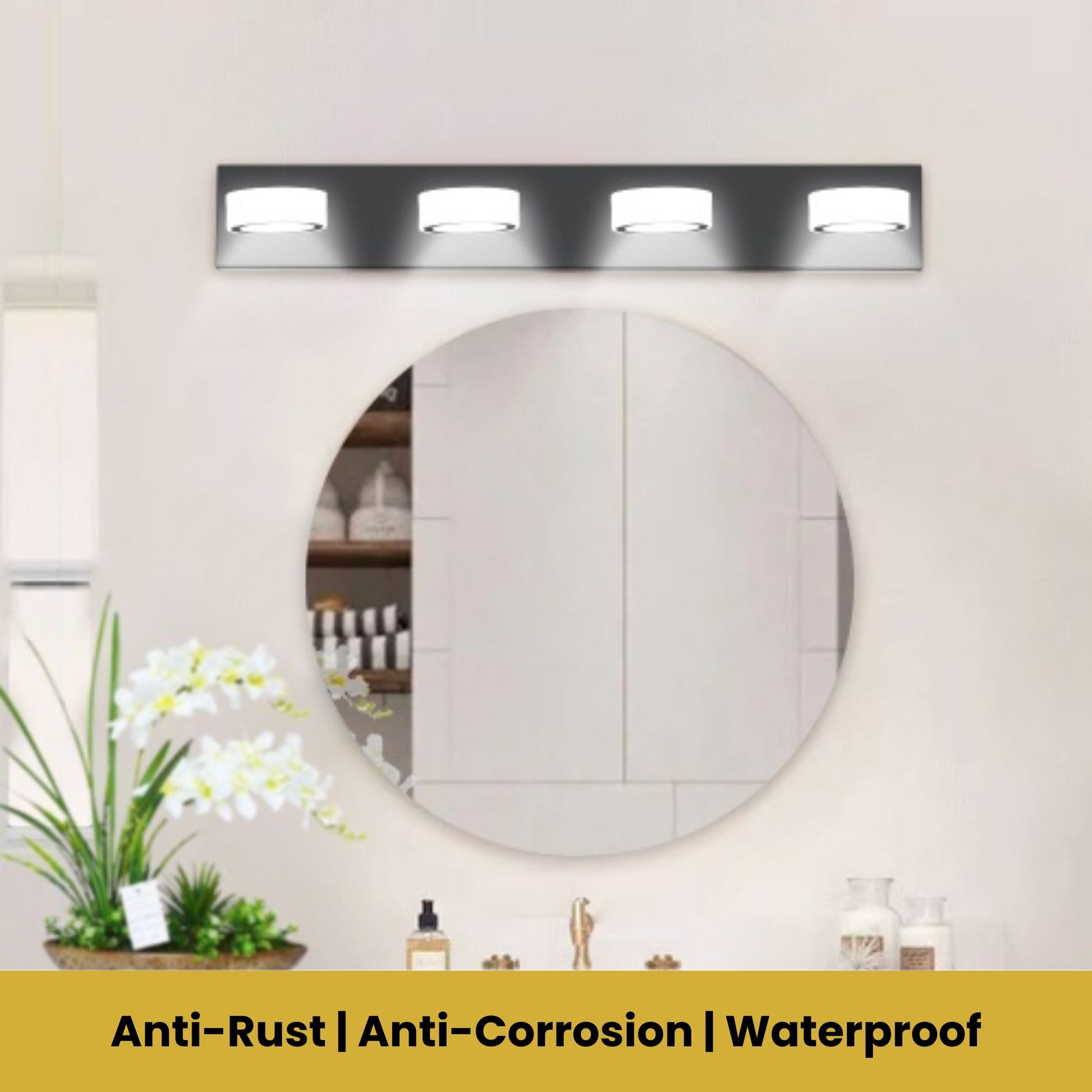 Round mirror with light fixture above it on a wall, with decorative elements below.