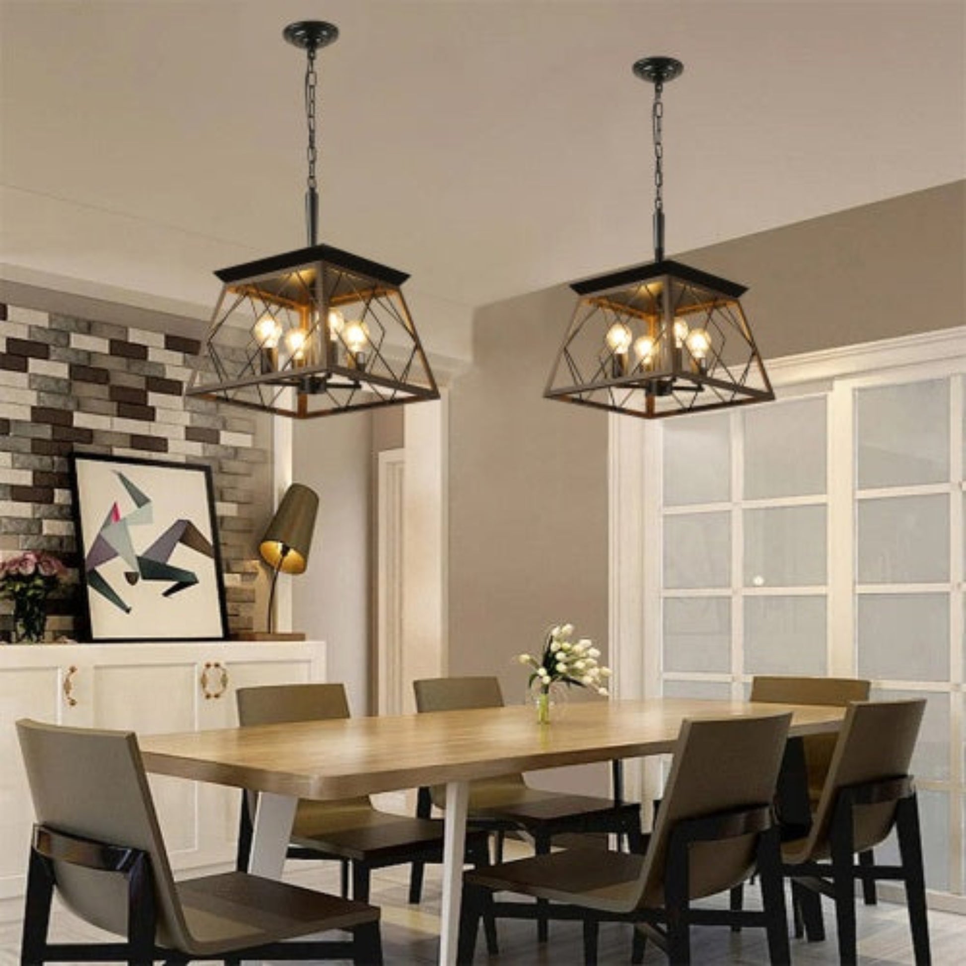 Dining room with pendant lights, table, and chairs.
