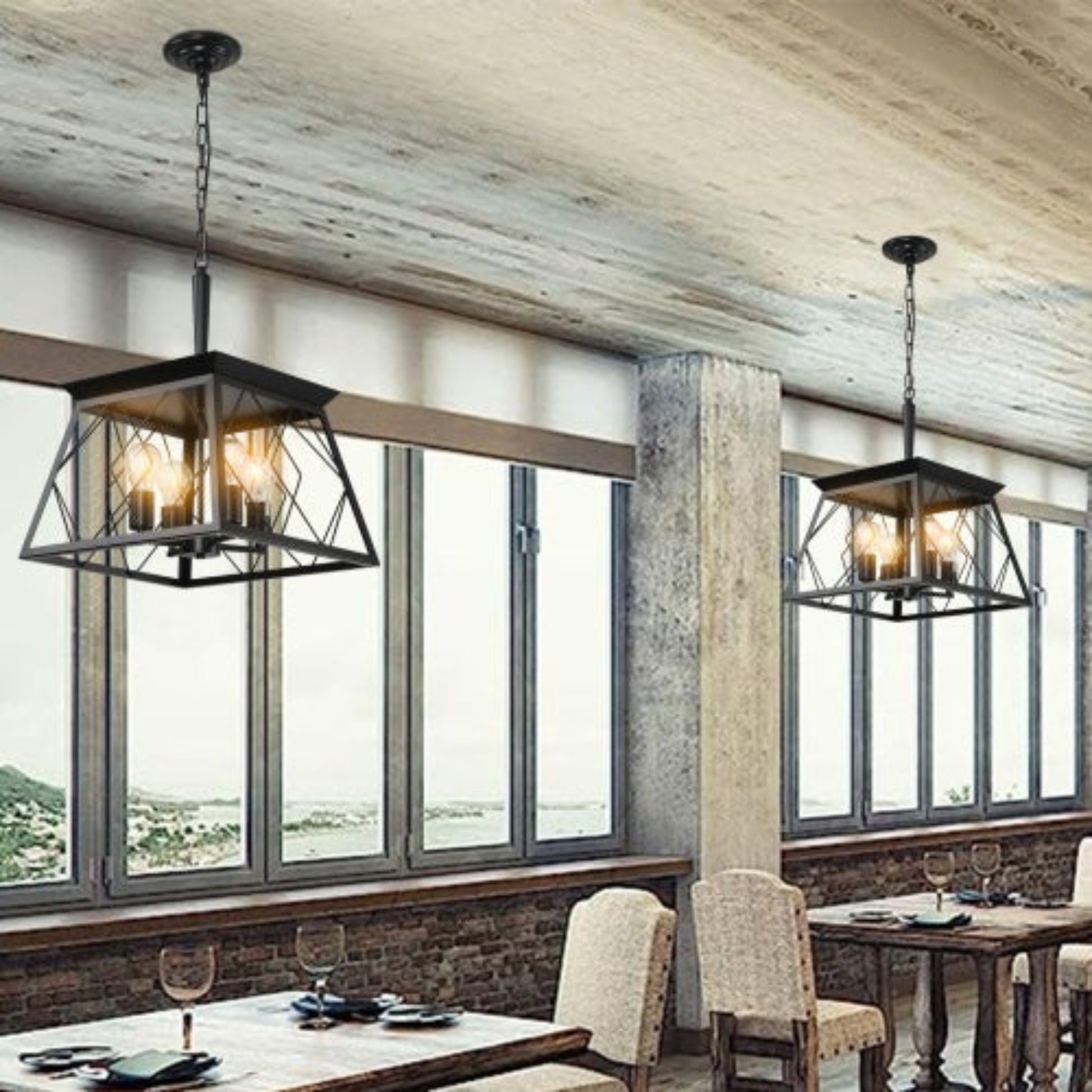 Dining room with pendant lights hanging above tables and chairs.