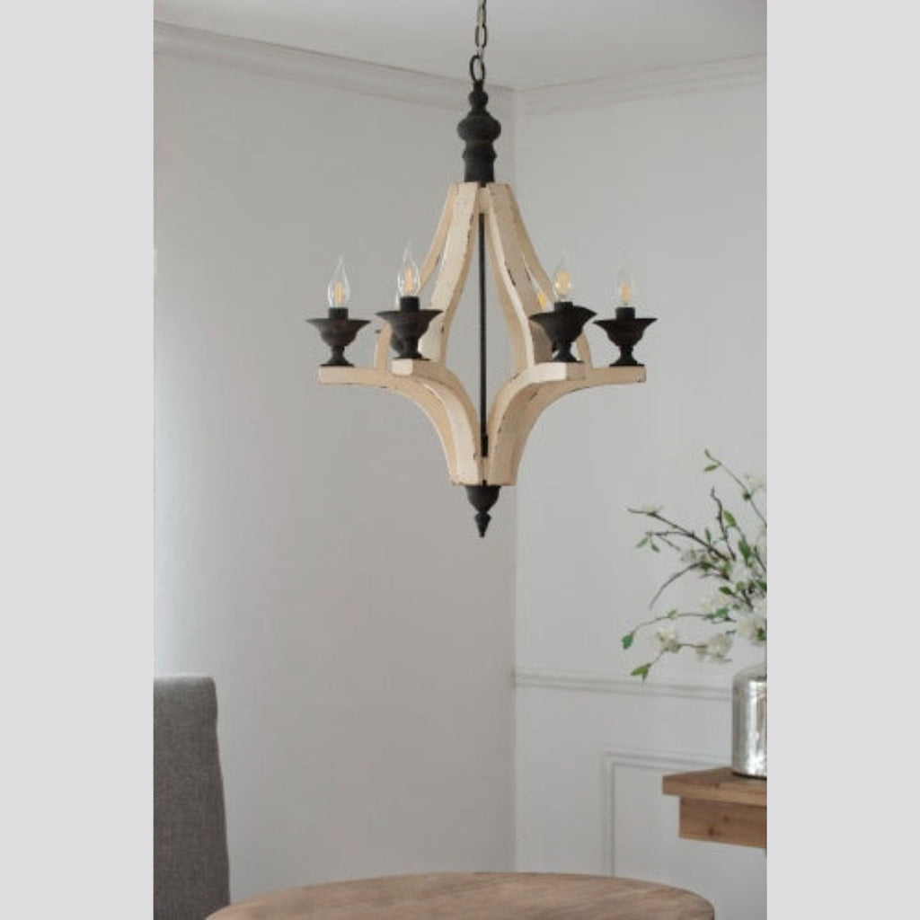 Wooden chandelier hanging in a room with a neutral color scheme.