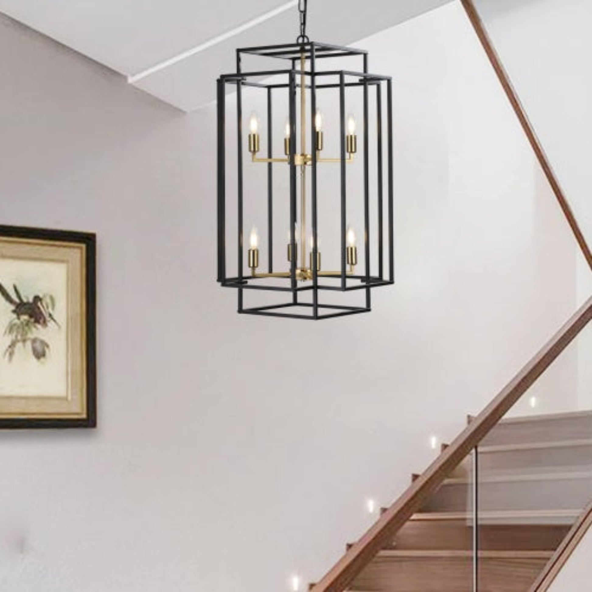 Modern black pendant light fixture hanging in a home interior with a staircase.