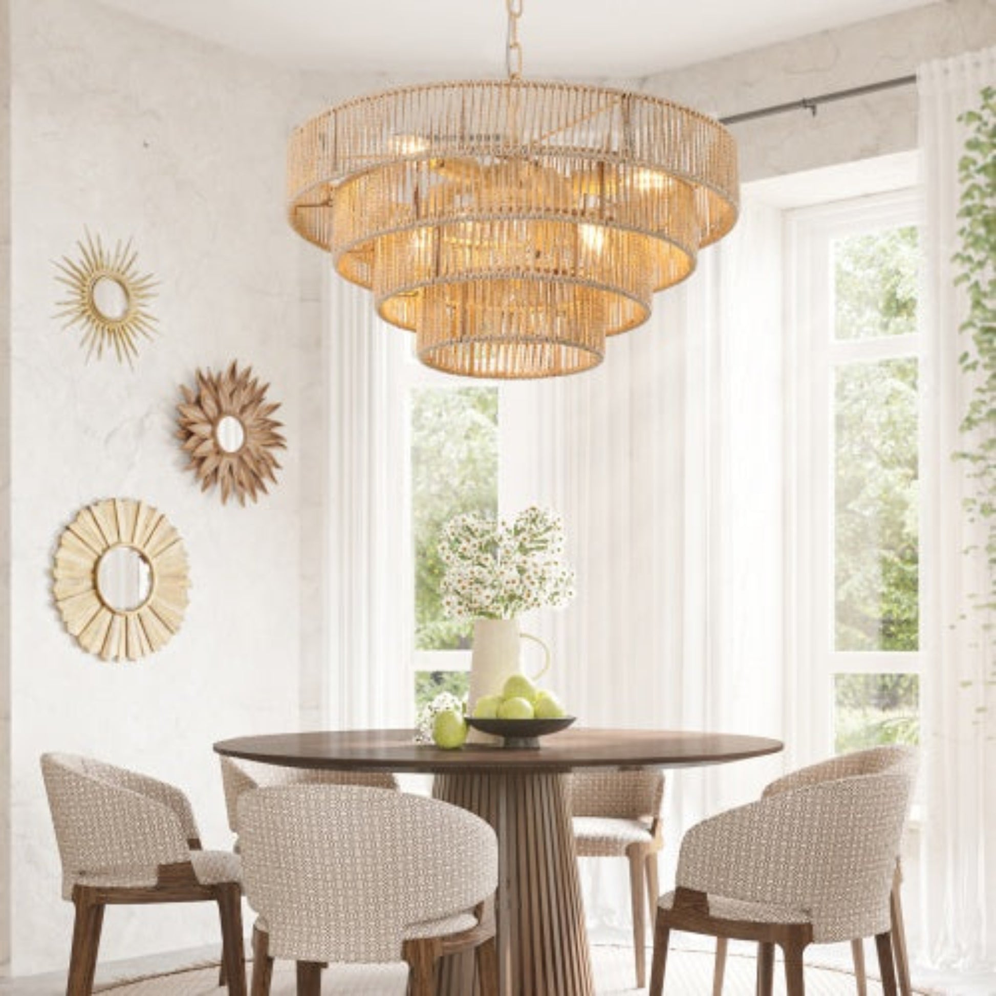 Dining room with a round wooden table and chairs, featuring a gold chandelier.
