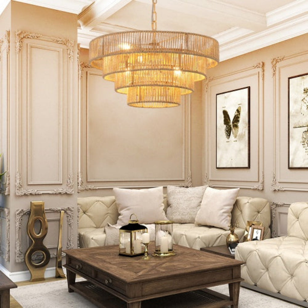 Luxurious living room with beige walls, gold chandelier, and decorative elements.