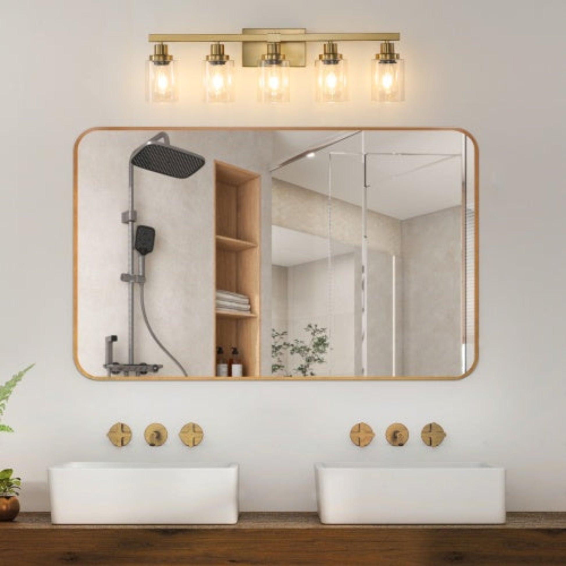 Bathroom with a large mirror, gold fixtures, and a light fixture.