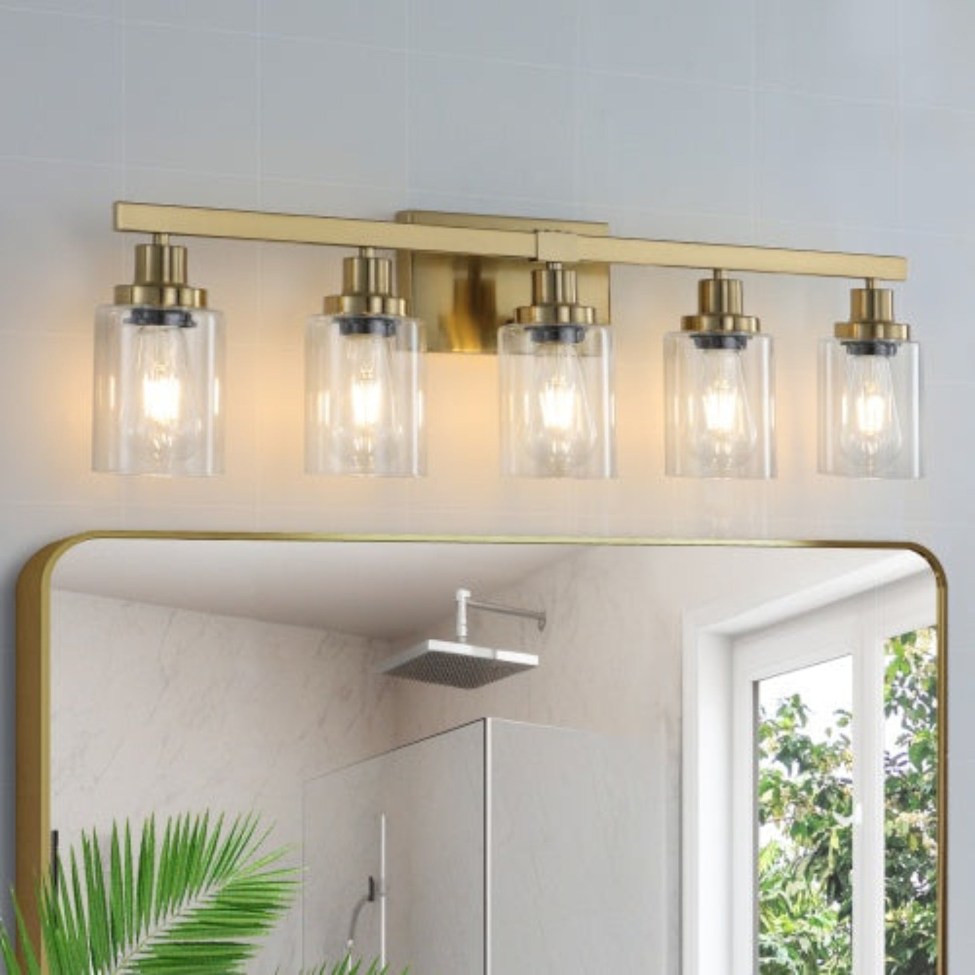 Modern bathroom light fixture with glass shades above a mirror.