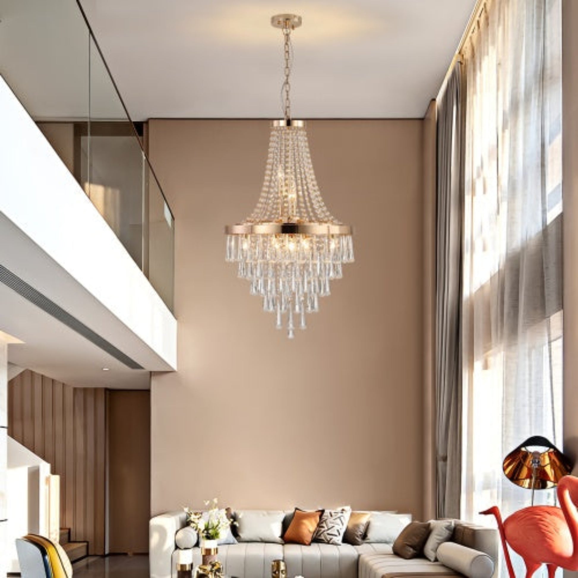 Modern living room with a chandelier, sofa, and decorative pillows.