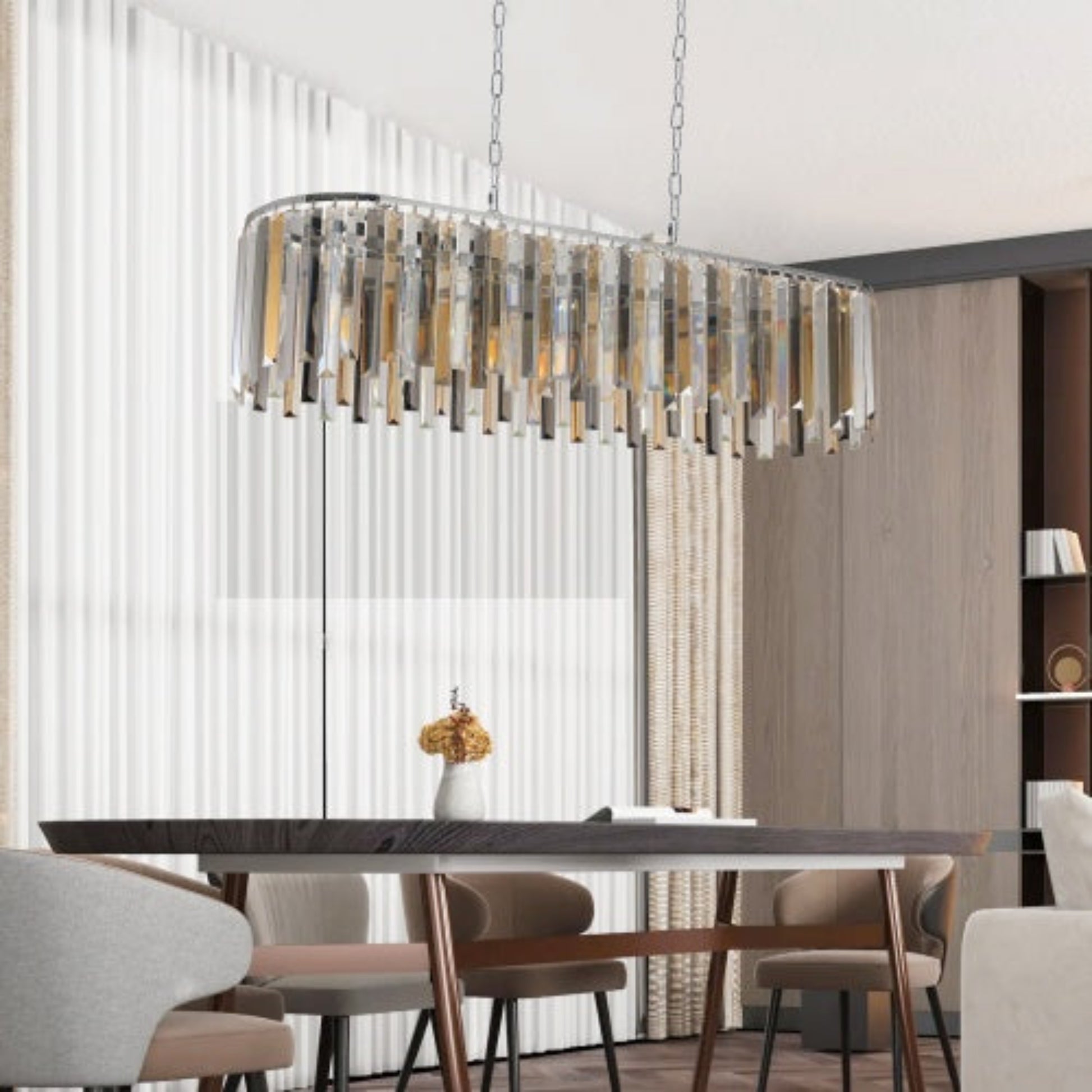 Modern chandelier hanging above a dining table in a stylish room with curtains and shelves.