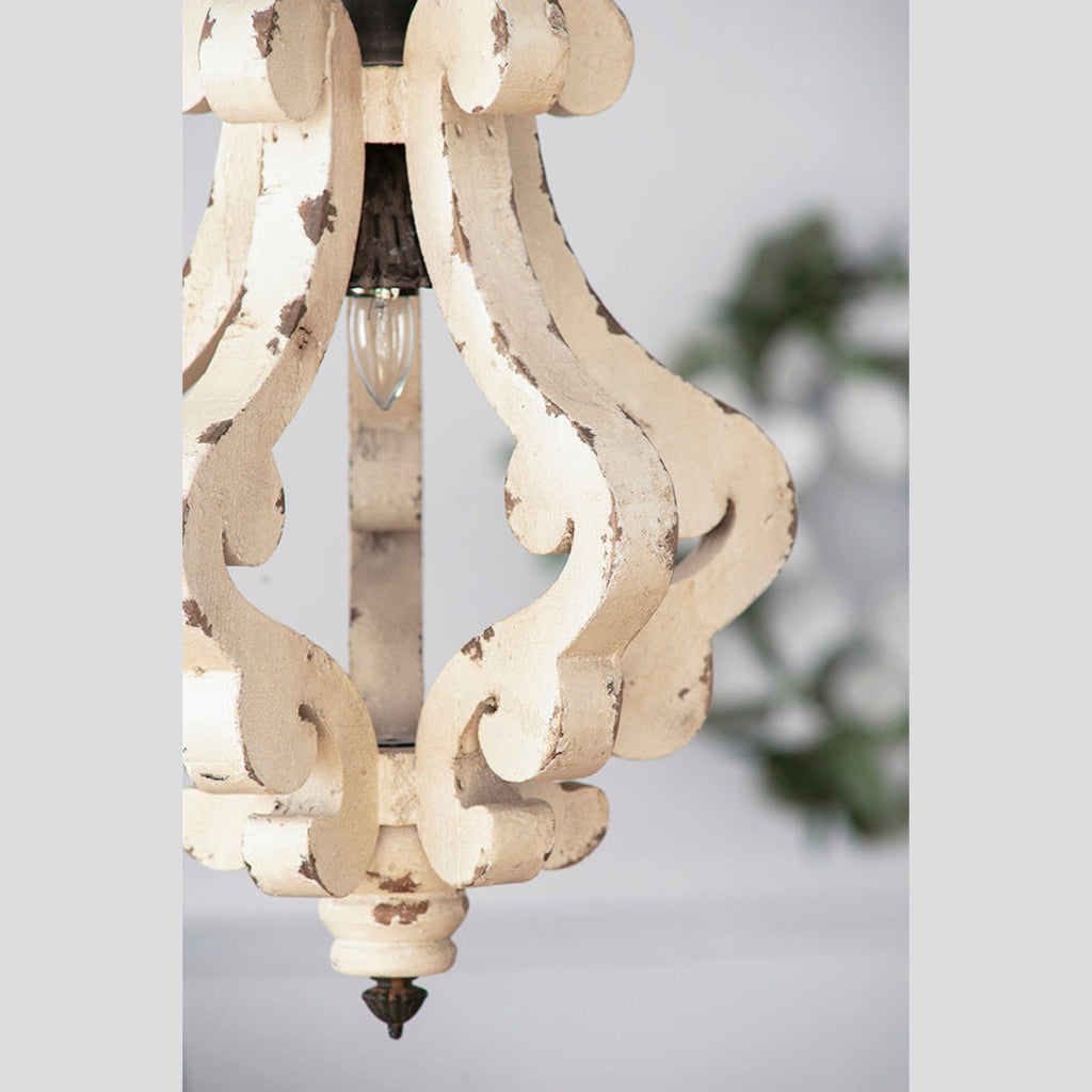 Decorative chandelier with intricate design on a light background